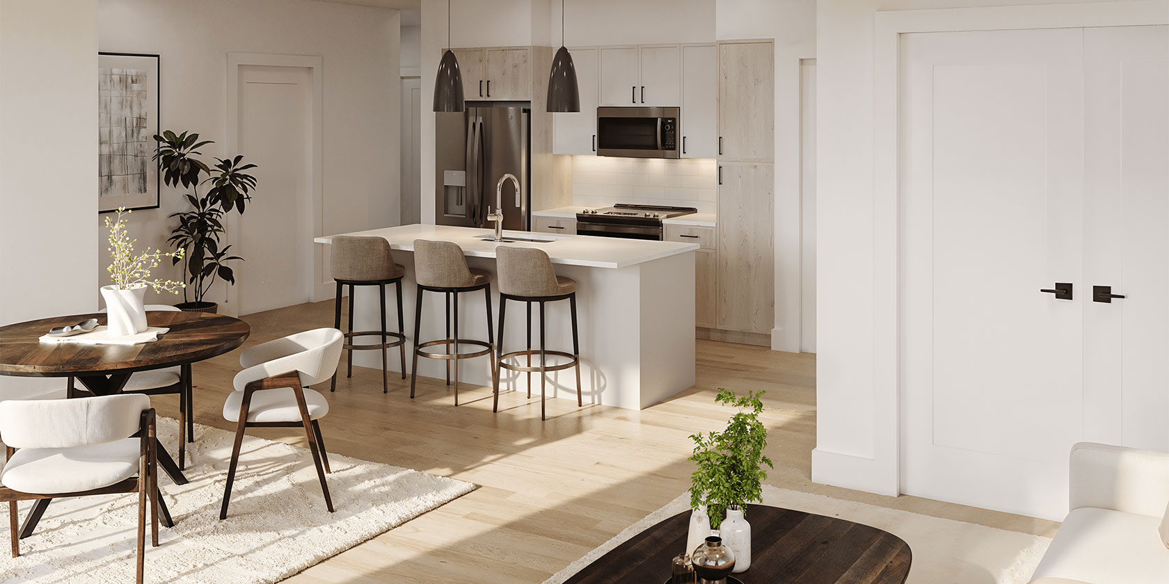 Apartment kitchen at The Asher featuring a central island with barstool seating, pendant lighting, stainless steel appliances, and white cabinetry. Open-concept layout includes a dining area and living space with wood flooring and contemporary decor.